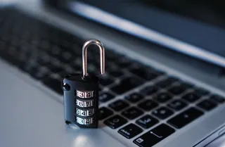 A combination padlock on a laptop keyboard
