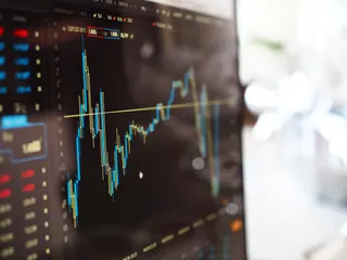 A financial trading screen with a candlestick chart