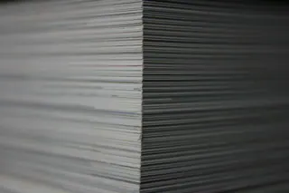 A close-up of stacked paper records