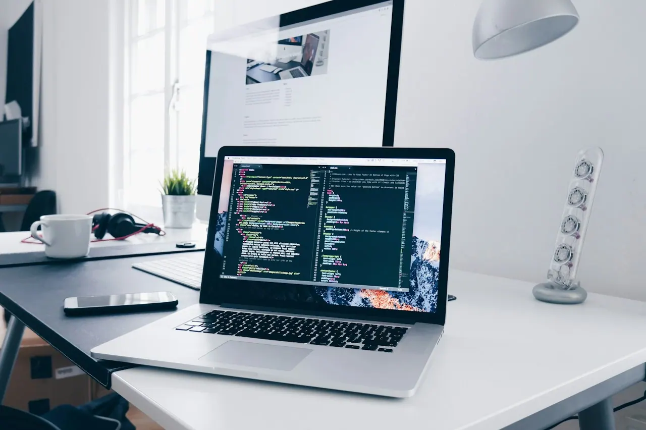 Laptop displaying computer code